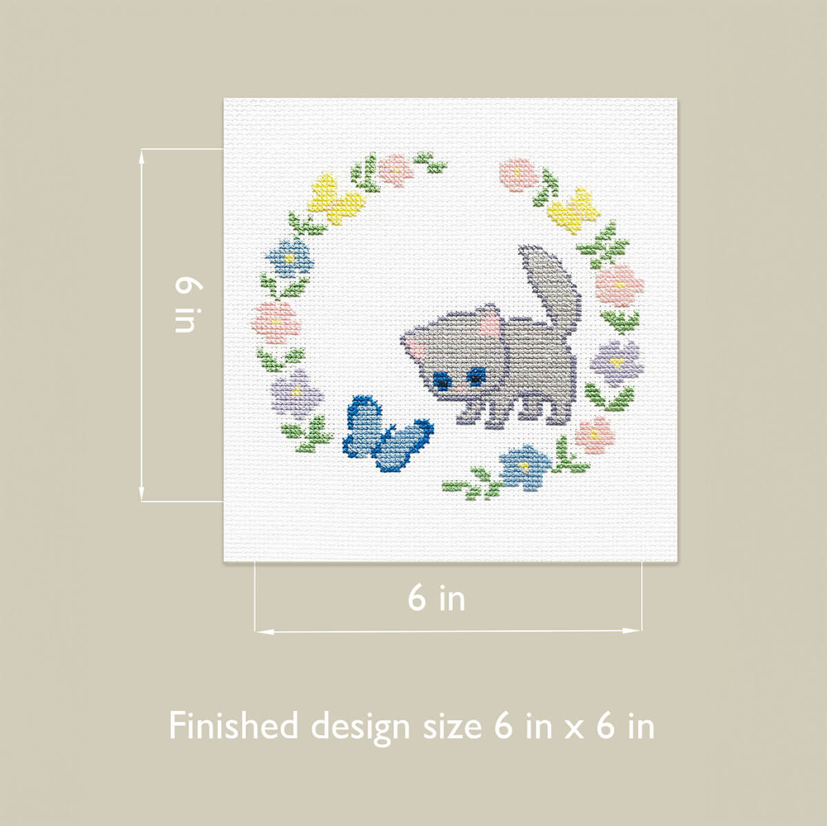 Cross-stitched design of a cat surrounded by flowers and butterflies with dimensions indicated, 6 inches by 6 inches
