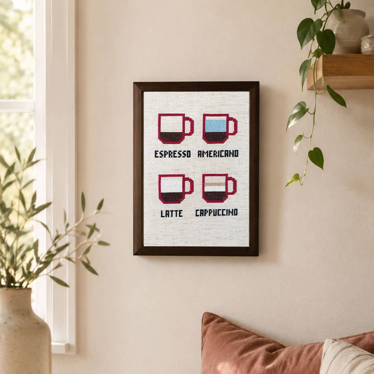 Framed Coffee lover cross stitch design featuring espresso, americano, latte, and cappuccino