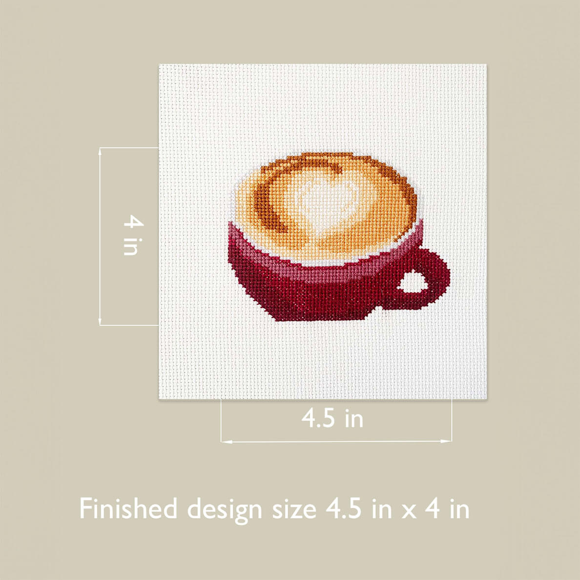 Cross-stitched design of a cappuccino with dimensions on a beige background