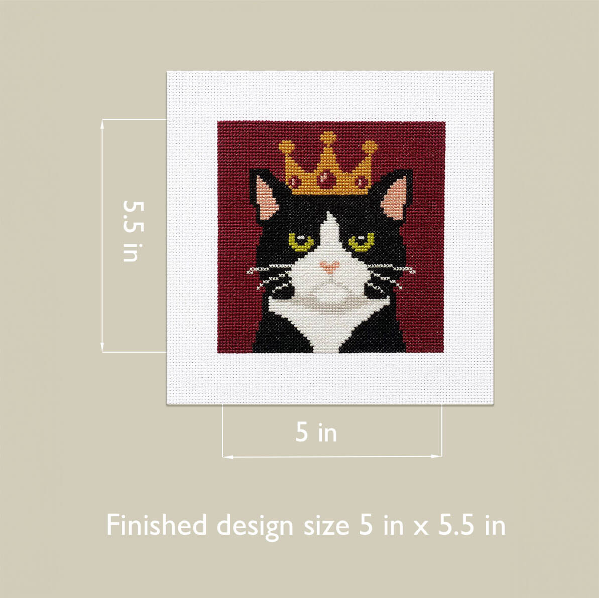 Cat with a crown on a cross-stitch design with measurements on a beige background