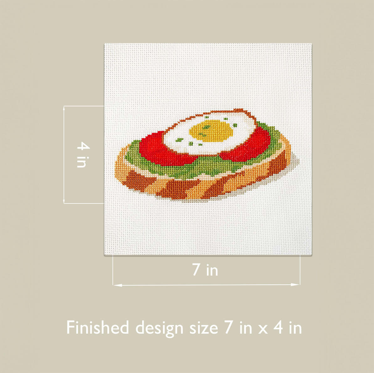 Avocado Toast cross stitch finished size diagram, 7 by 4 inches.