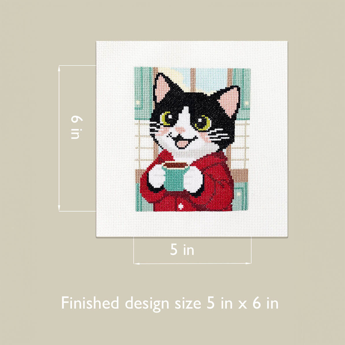 Cross-stitched design of a cat holding a mug with dimensions 5 in x 6 in on a beige background.